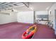 Clean, spacious garage with room for bike, kayak, workbench, and storage cabinets at 2504 Gatlin Ave, Orlando, FL 32806