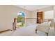 Bright upstairs hallway features large window, banister, shelving, and seating area at 2504 Gatlin Ave, Orlando, FL 32806
