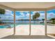 Covered patio framing the pool with spa, with incredible lake view at 2504 Gatlin Ave, Orlando, FL 32806