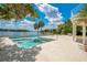 A stunning pool overlooks the beautiful lake, perfect for relaxation and entertainment at 2504 Gatlin Ave, Orlando, FL 32806