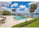 Inviting pool with lake view, perfect for relaxation or entertaining guests at 2504 Gatlin Ave, Orlando, FL 32806