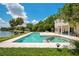 Outdoor pool and patio provide a relaxing oasis with beautiful lake views at 2504 Gatlin Ave, Orlando, FL 32806