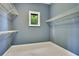 Empty walk-in closet is ready to be transformed into an organized storage space at 2504 Gatlin Ave, Orlando, FL 32806