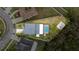 Aerial view of home showcasing fenced yard, screened pool, and basketball court at 2831 Orange Haven Way, Kissimmee, FL 34746