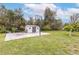 Spacious backyard features a storage shed, basketball hoop, and mature trees at 2831 Orange Haven Way, Kissimmee, FL 34746
