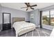 Neutral bedroom boasts a ceiling fan, carpet, a window, dresser, and gray walls for a modern look at 2831 Orange Haven Way, Kissimmee, FL 34746
