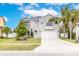 Charming two-story home with a well-manicured lawn and attached two-car garage at 2831 Orange Haven Way, Kissimmee, FL 34746