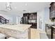Modern kitchen features granite countertops, stainless steel appliances, and dark wood cabinetry at 2831 Orange Haven Way, Kissimmee, FL 34746