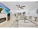 Spacious living room with a large sectional sofa and a stylish rug, open to dining area at 2831 Orange Haven Way, Kissimmee, FL 34746