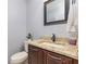 Stylish powder room with granite countertop, undermount sink and a modern faucet at 2831 Orange Haven Way, Kissimmee, FL 34746