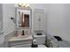 Cozy bathroom with decorative mirror, single vanity and a toilet at 2833 Ne 18Th Ct, Ocala, FL 34470
