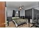 Comfortable bedroom with a ceiling fan, and ample natural light at 2833 Ne 18Th Ct, Ocala, FL 34470