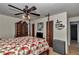 Spacious bedroom boasts a four-poster bed, ceiling fan, and ample natural light at 2833 Ne 18Th Ct, Ocala, FL 34470