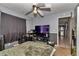 Comfortable bedroom with a ceiling fan, and ample natural light at 2833 Ne 18Th Ct, Ocala, FL 34470