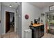 Kitchen area showing white brick accent wall and a movable butcher block island cart at 2833 Ne 18Th Ct, Ocala, FL 34470