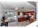 Charming kitchen features wood cabinets, stainless steel appliances, and a sliding glass door to the patio at 2833 Ne 18Th Ct, Ocala, FL 34470