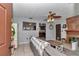 Comfortable living room with a fireplace, neutral color walls, tile flooring, and plenty of natural light at 2833 Ne 18Th Ct, Ocala, FL 34470