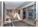 A screened-in porch features neutral paint, an area rug, and sliding glass doors leading to the home's interior at 2833 Ne 18Th Ct, Ocala, FL 34470