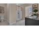 Bright bathroom with a white tiled floor, a toilet, and a shower tub combo at 2972 Moulin Rd, Davenport, FL 33837