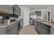 Well-equipped kitchen featuring stainless steel appliances, granite counters and ample cabinet space at 2972 Moulin Rd, Davenport, FL 33837
