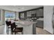 Spacious kitchen showcasing a granite countertop island, stainless steel appliances, and ample cabinet space at 2972 Moulin Rd, Davenport, FL 33837