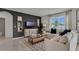 Bright living room featuring modern furnishings, a decorative rug, and ample natural light at 2972 Moulin Rd, Davenport, FL 33837