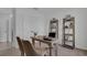 Bright office space featuring a desk, chairs, and shelving units for organization and decor at 2972 Moulin Rd, Davenport, FL 33837