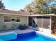 Beautiful backyard pool and patio area, perfect for outdoor entertaining and relaxation at 32804 Blossom Ln, Leesburg, FL 34788