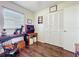 Bright bedroom with wood-look flooring, closet, and vintage decor at 32804 Blossom Ln, Leesburg, FL 34788