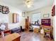 Charming bedroom featuring wood floors and an array of vintage furniture and decor at 32804 Blossom Ln, Leesburg, FL 34788