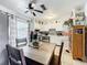 Cozy eat-in kitchen with a view to the pool, stainless steel appliances, and bright white cabinetry at 32804 Blossom Ln, Leesburg, FL 34788