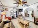 Comfortable living room with stone fireplace, hardwood accents, and open layout at 32804 Blossom Ln, Leesburg, FL 34788