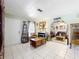 Spacious living room with tiled floors, comfortable seating, and stylish decor throughout at 32804 Blossom Ln, Leesburg, FL 34788