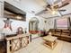 Inviting living room with open floor plan, wood accents, and comfortable furnishings at 32804 Blossom Ln, Leesburg, FL 34788