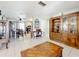 Spacious living room leading to the kitchen and dining area, with a large cabinet at 32804 Blossom Ln, Leesburg, FL 34788