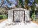 A white shed with a concrete foundation stands ready for storage needs at 32804 Blossom Ln, Leesburg, FL 34788