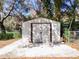 A white shed with a concrete foundation stands ready for storage needs at 32804 Blossom Ln, Leesburg, FL 34788
