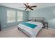 Comfortable bedroom with neutral carpet, ceiling fan, and two windows bringing in natural light at 339 Capron Ash Loop, Casselberry, FL 32707