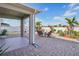 Paver patio featuring outdoor seating, tropical landscaping, and privacy fence at 365 Quarry Rock Cir, Kissimmee, FL 34758