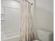 Bathroom shower with colorful curtain and white ceramic tile at 365 Quarry Rock Cir, Kissimmee, FL 34758