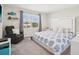Cozy bedroom with a large window, carpet flooring, and comfortable furnishings at 365 Quarry Rock Cir, Kissimmee, FL 34758