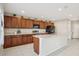 Spacious kitchen with dark wood cabinets, stainless steel appliances, and a center island at 365 Quarry Rock Cir, Kissimmee, FL 34758