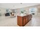 Spacious kitchen area with a center island, dark wood cabinets, and an open layout at 365 Quarry Rock Cir, Kissimmee, FL 34758
