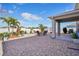 Spacious backyard featuring a paved patio area, landscaping, and a basketball hoop at 365 Quarry Rock Cir, Kissimmee, FL 34758