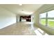 Bright and airy living room with tile floors and sliding glass doors to the lanai at 3854 Carrick Bend Dr, Kissimmee, FL 34746