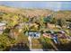 Aerial view of a home near a body of water showing solar panels and well-maintained landscaping at 38934 Sulen Rd, Lady Lake, FL 32159