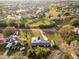 The property's boundary lines are showcased in this aerial view of a home with solar panels and a screened pool at 38934 Sulen Rd, Lady Lake, FL 32159