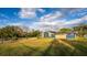 Sprawling backyard view with home, pool, and brick fence at 38934 Sulen Rd, Lady Lake, FL 32159