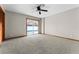 Bedroom has light grey carpet and a glass sliding door offering a view of the pool at 38934 Sulen Rd, Lady Lake, FL 32159