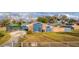This charming home has a lush green lawn and a screened-in pool area at 38934 Sulen Rd, Lady Lake, FL 32159